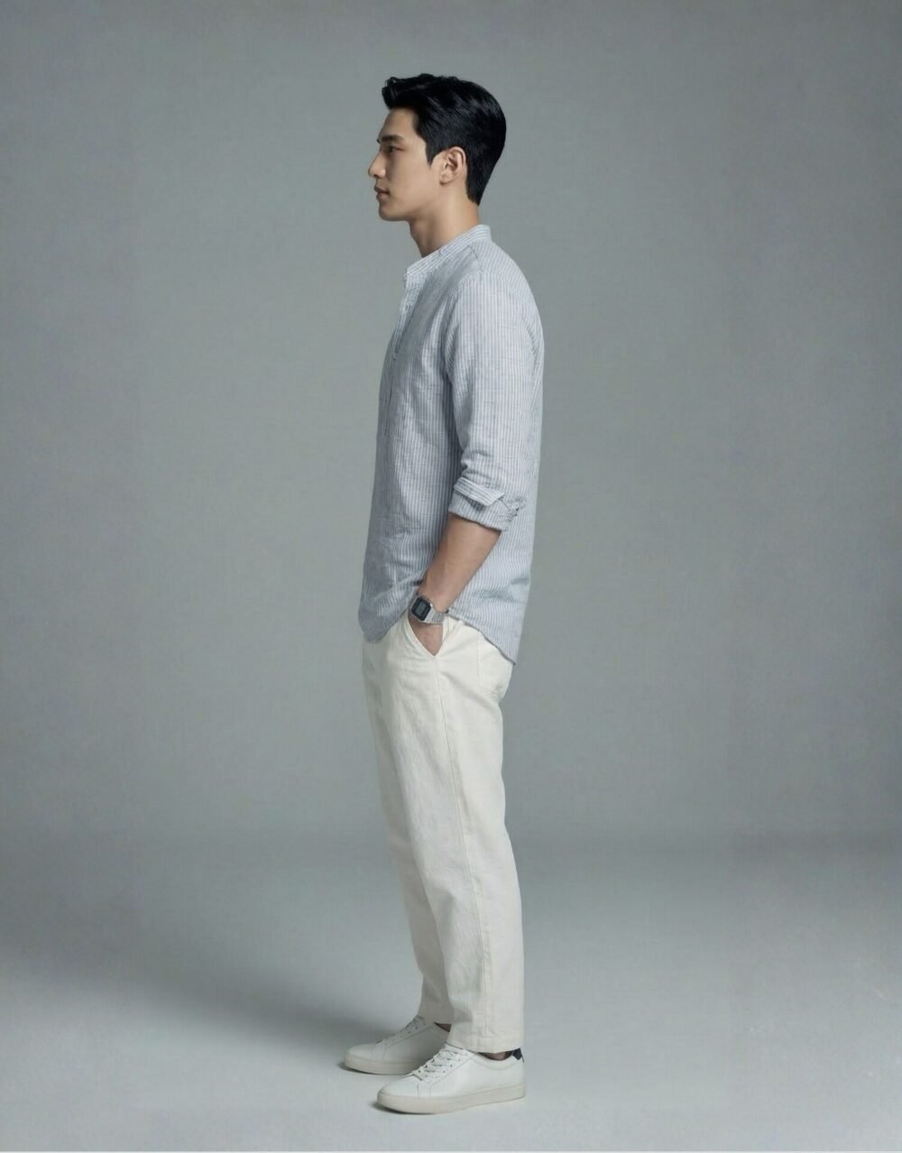 Relaxed-fit striped Henley shirt paired with lightweight trousers in an effortless smart-casual look