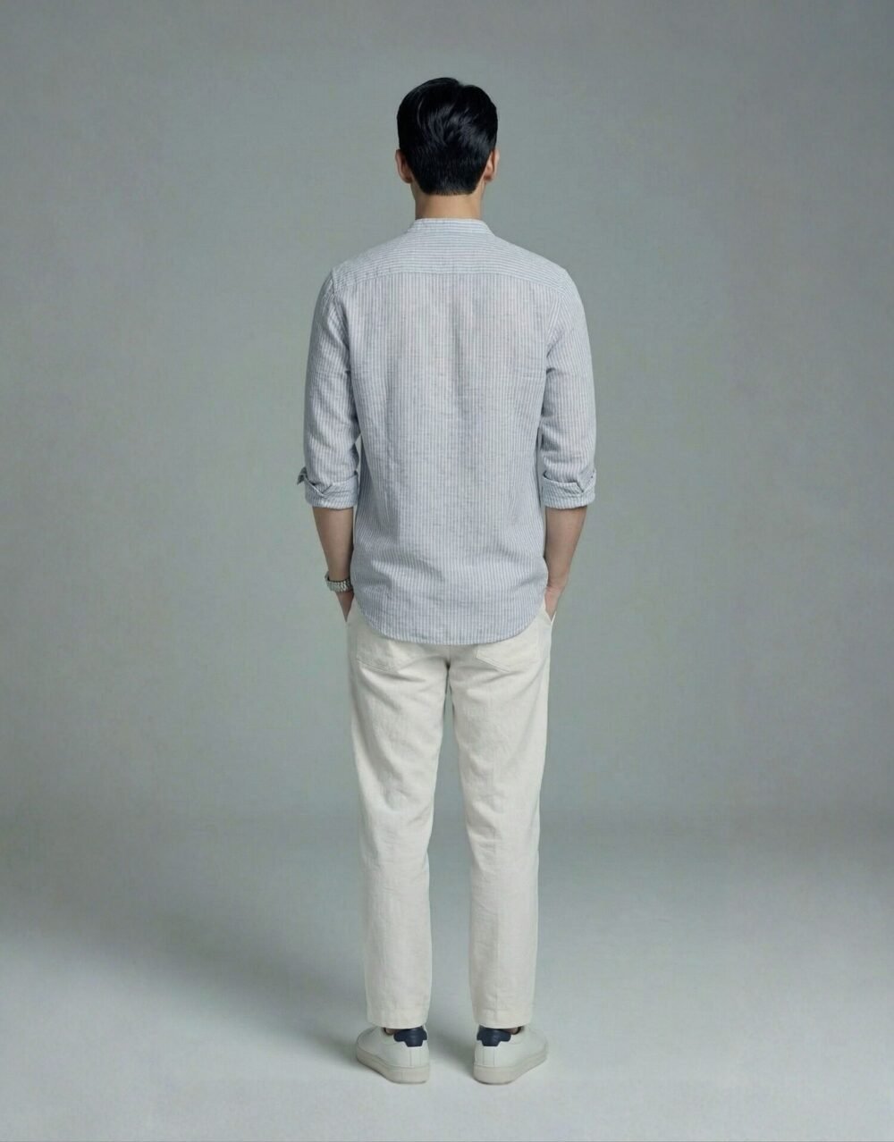 Relaxed-fit striped Henley shirt paired with lightweight trousers in an effortless smart-casual look