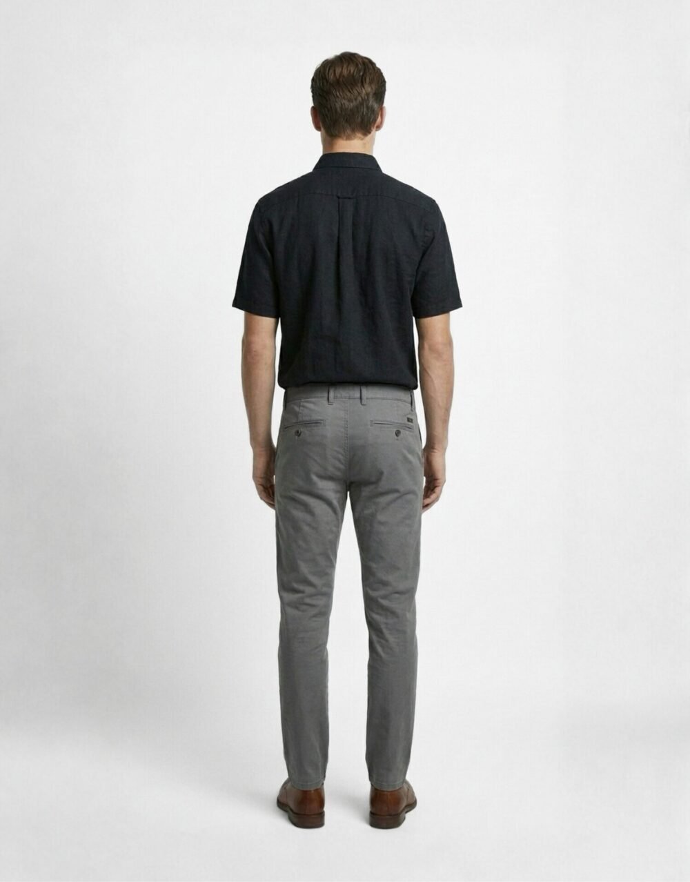 Slim-fit short-sleeve shirt paired with tailored trousers for a clean, minimal smart-casual look