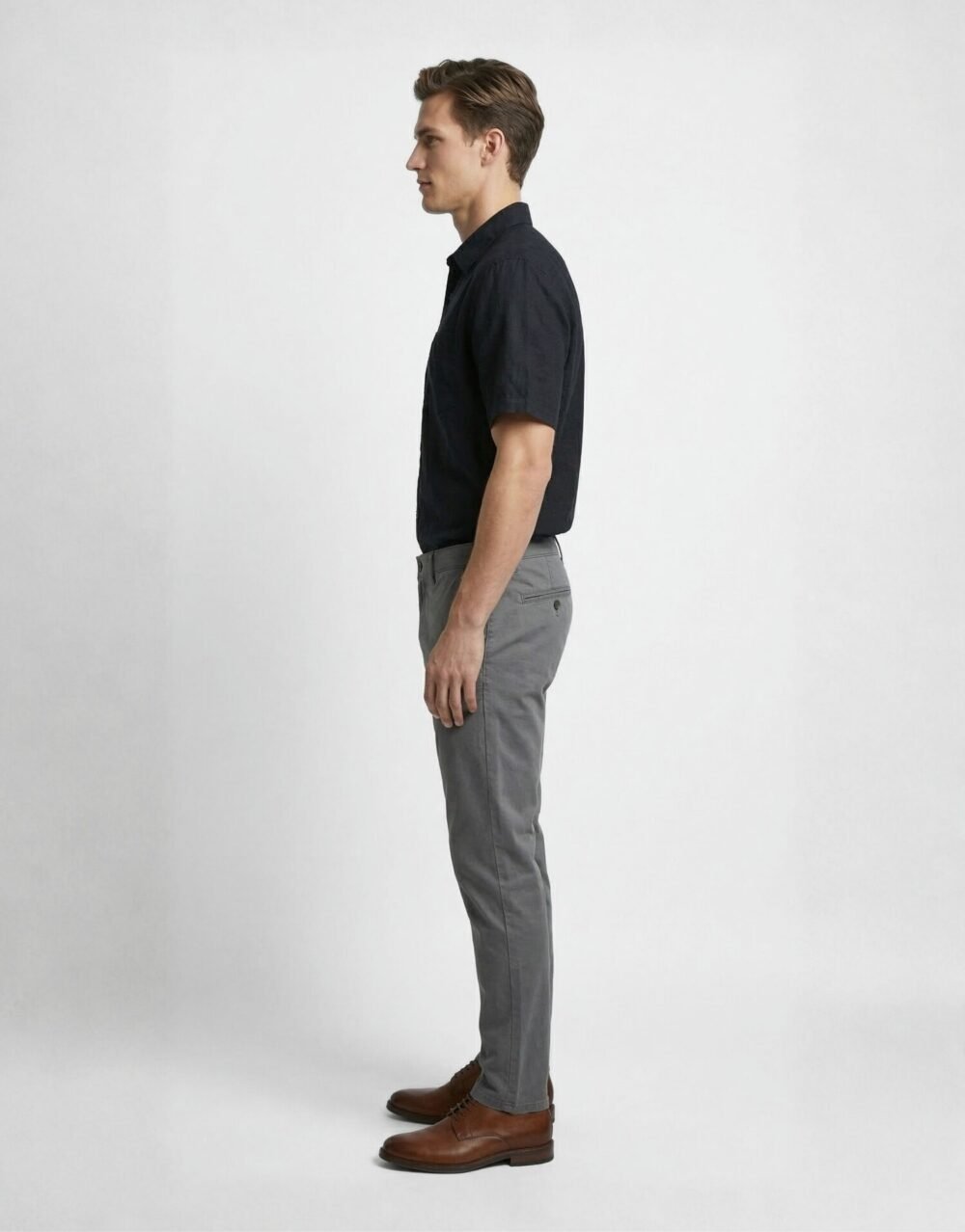 Slim-fit short-sleeve shirt paired with tailored trousers for a clean, minimal smart-casual look