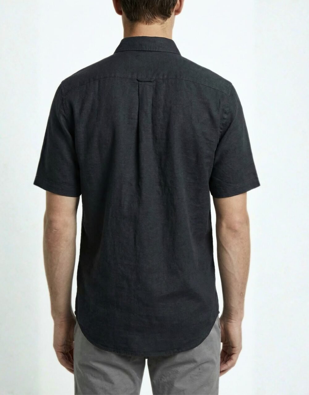 Slim-fit short-sleeve shirt paired with tailored trousers for a clean, minimal smart-casual look