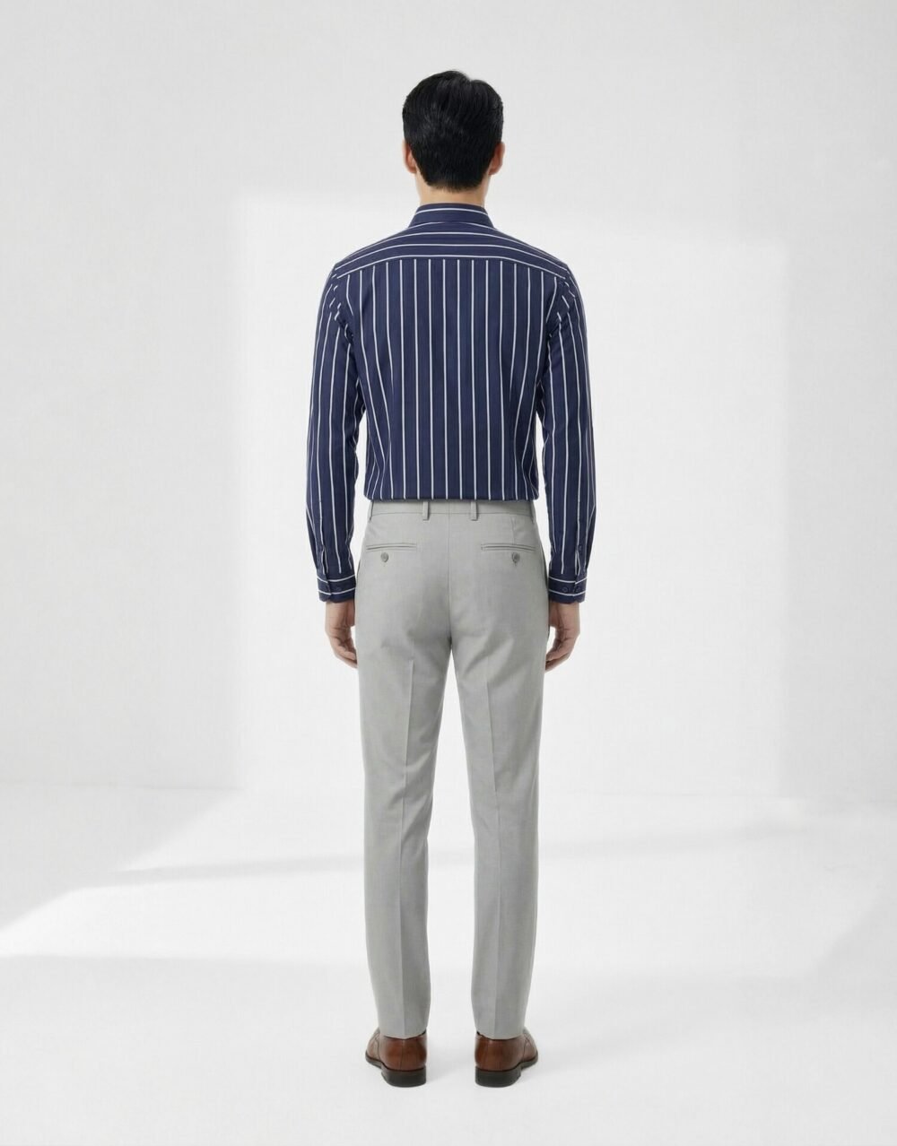 Slim-fit striped shirt with tailored trousers in a clean, modern smart-casual silhouette