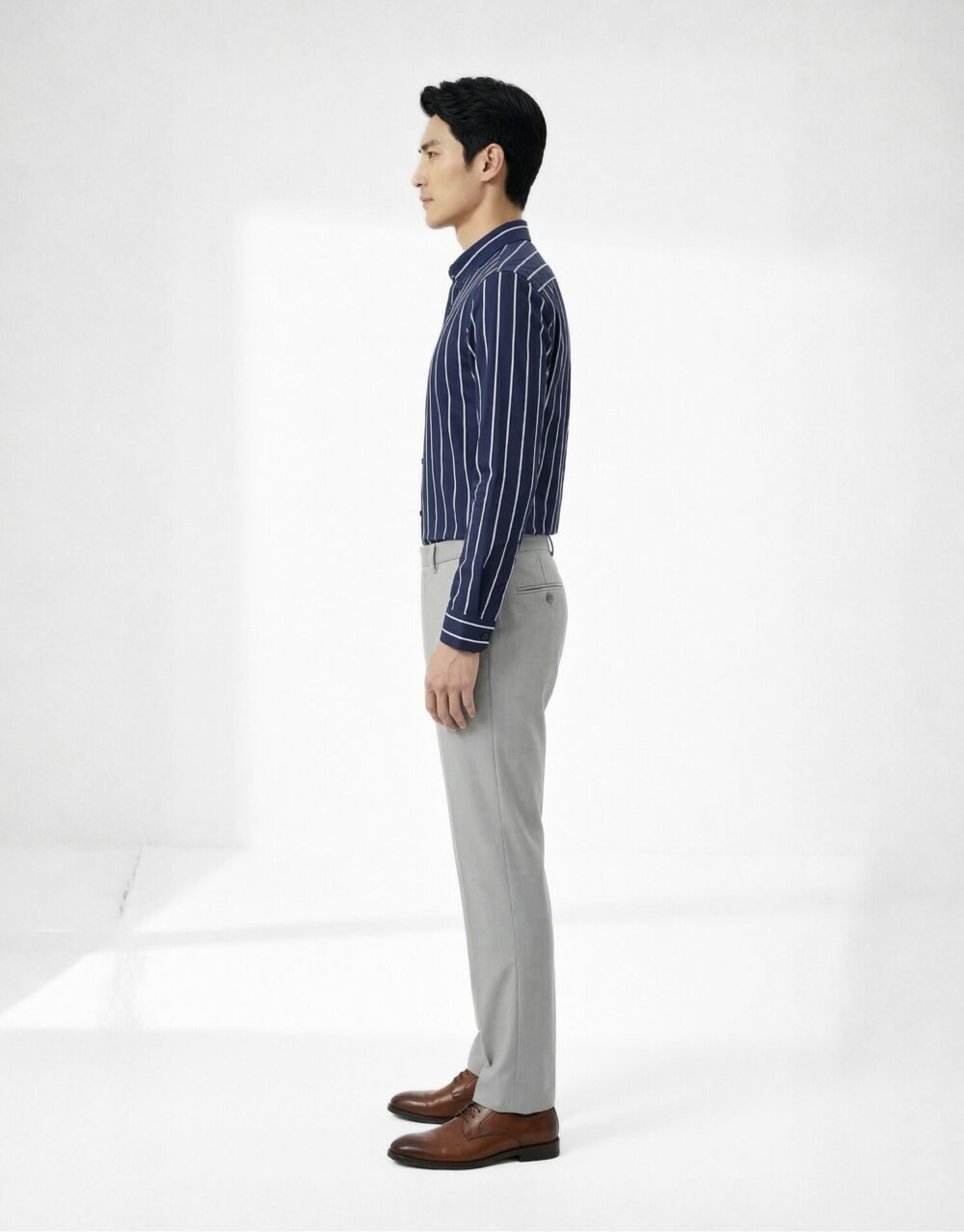 Slim-fit striped shirt with tailored trousers in a clean, modern smart-casual silhouette